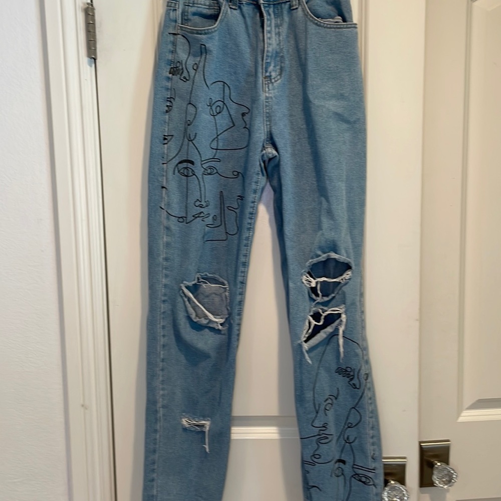 Ripped, patterned jeans